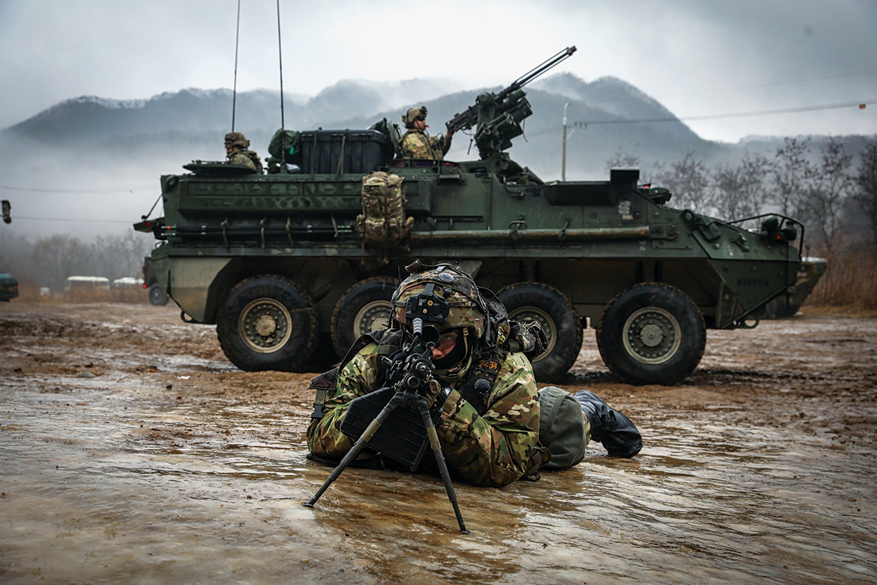 A squad automatic weapon gunner with the 2nd Stryker Brigade Combat Team, 2nd Infantry Division, pulls security at South Korea’s Twin Bridges Training Area. (Credit: U.S. Army/Sgt. Jerod Hathaway)