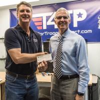 Mike Flanagan, Chapter President, welcomes new Corporate member Mark Casper, Tech4Troops