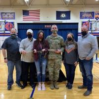 PCHS Coach Worley, AUSA Rep Frank Cannavo, Layla Blevins, SFC Armentrout, Layla's parents Jessica and Chris Blevins
