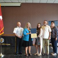 Ms. Elisabeth Novak receives her scholarship from President Dr. Cynthia Gatto and MG Timothy Thomblesono 