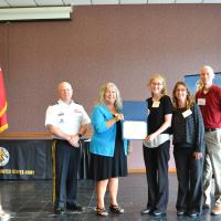 Ms. Lucy Pickett receives her scholarship from President Dr. Cynthia Gatto and MG Timothy Thombleson