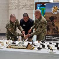 SPC Levy _ COL Patterson and MG Burkett Cutting the Cake