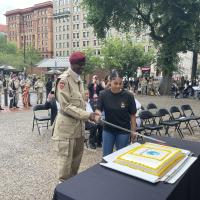 OLDEST AND YOUGEST SOLDIERS CUTTING THE ARMY BIRTHDAY CAKE