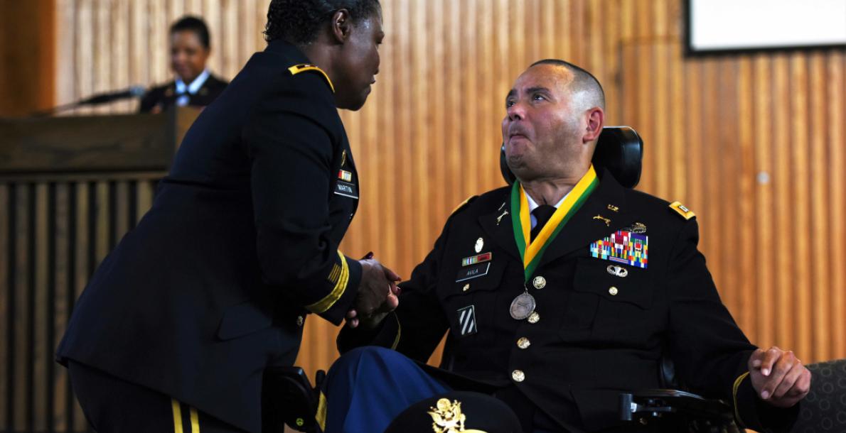 Capt. Luis Avila receives award from Army Inspector General Lt. Gen. Donna Martin