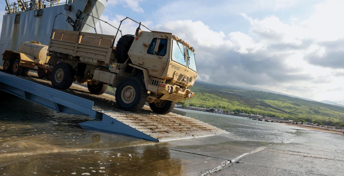 Troops with the 25th Infantry Division unload vehicles from an Army Logistics Support Vessel for a Joint Pacific Multinational Readiness Center exercise in Hawaii. (Credit: U.S. Army/Pfc. Owen Stupcenski)