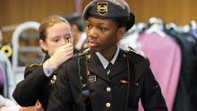Cadets adjusting uniform