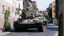 A U.S. Army M60A1 ‘Patton’ tank moves through a village in West Germany during the 1982 REFORGER exercise. (Credit: Wikipedia)