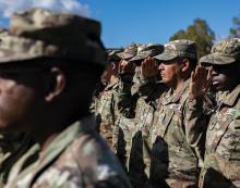 Soldiers with the 101st Airborne Division (Air Assault) Sustainment Brigade salute the U.S. flag during a ceremony to uncase the unit’s colors at Grafenwoehr Training Area, Germany.