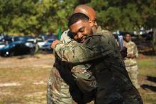 During his promotion ceremony at Fort Bragg, North Carolina, Sgt. Nathaniel Hendrix, right, hugs one of his mentors, Sgt. 1st Class Ernest Knight.During his promotion ceremony at Fort Bragg, North Carolina, Sgt. Nathaniel Hendrix, right, hugs one of his mentors, Sgt. 1st Class Ernest Knight.