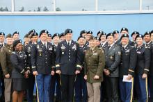 Maj. Gen. Jeff Broadwater, center, deputy commanding general of V Corps, stands with students after a commencement ceremony at the U.S. Army Reserve’s 7th Intermediate Level Education Detachment, 7th Mission Support Command, Grafenwoehr, Germany.