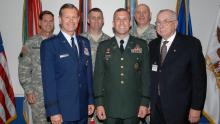 John ‘J.T.’ Thomson, front row center, stands for a photo with retired Brig. Gen. Robert Berry, right, and other officers during Thomson’s 2005 promotion to colonel at the Pentagon. (Credit: Courtesy Photo)