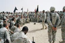 Then-Lt. Col. Dave Miller talks to soldiers from the 1st Battalion, 14th Infantry Regiment, at the end of their mission in Najaf, Iraq, in July 2004.