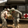 Medical personnel helping soldier