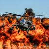 Apache Helicopter With Explosion in the Background