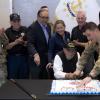 WW2 Vet, Lou Dolce cutting the cake
